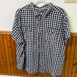 Woman within short sleeve blue and white checkered shirt